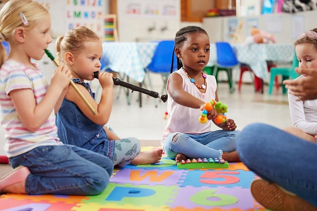 Shot of children learning about musical instruments in class